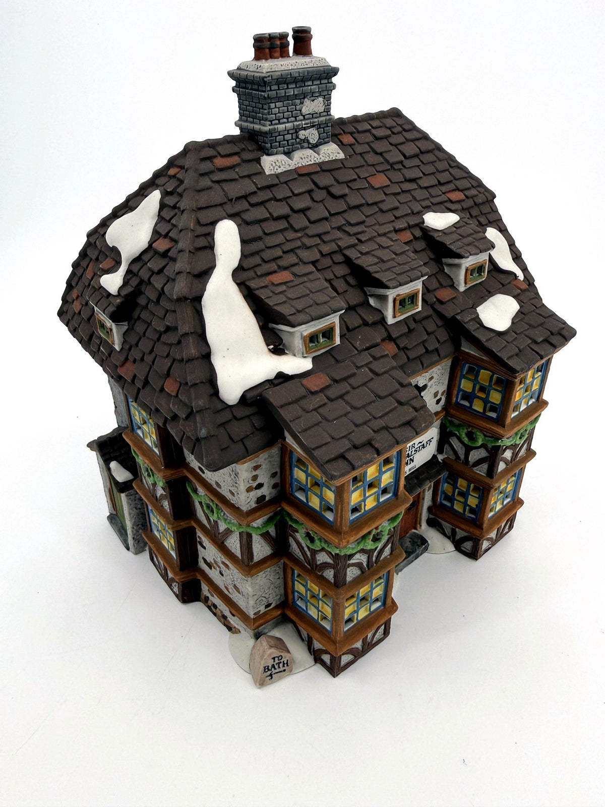 Sir John Falstaff Inn three-quarter front view — half-timbered façade, bay windows and snow-covered slate roof