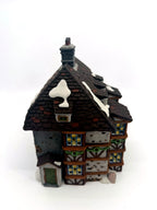 Sir John Falstaff Inn angled side view — timber-framed bays, lattice windows and stone base