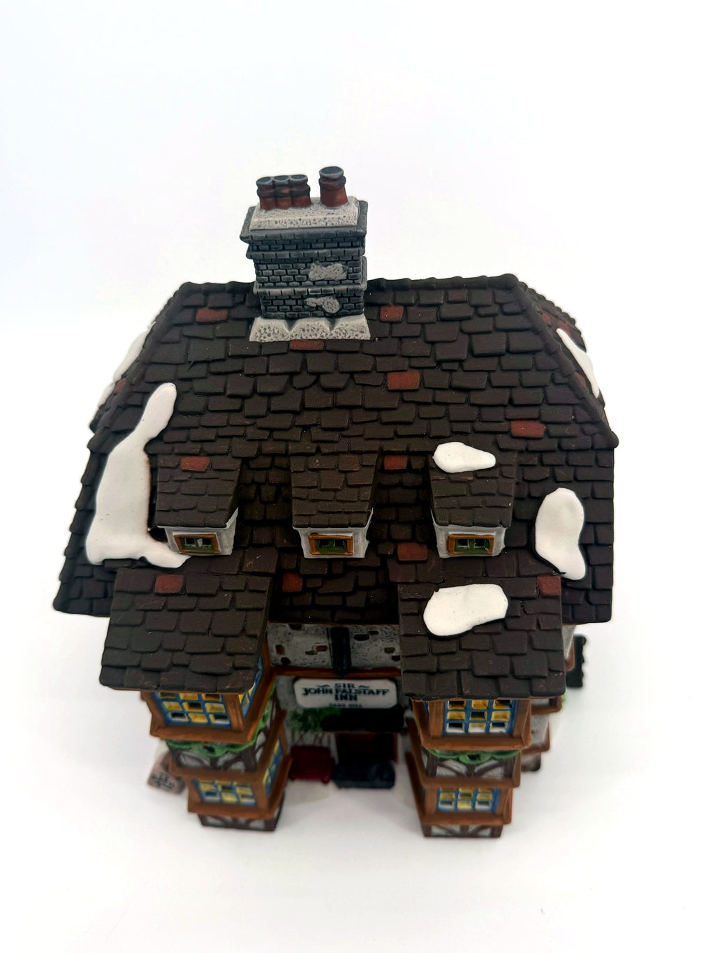 Sir John Falstaff Inn roof detail — snow-dusted slate shingles, chimneys and the hanging sign seen from above