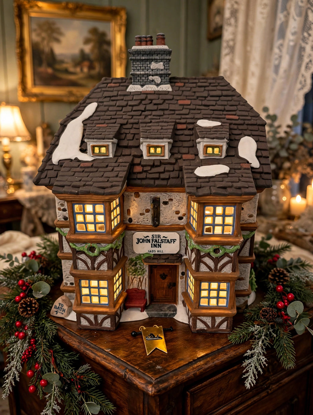 Styled lifestyle photo — Sir John Falstaff Inn displayed on an antique wooden sideboard with Christmas greenery inside a vintage home (display inspiration)