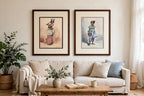 Styled lifestyle photo - the pair hanging above a linen sofa (display inspiration)