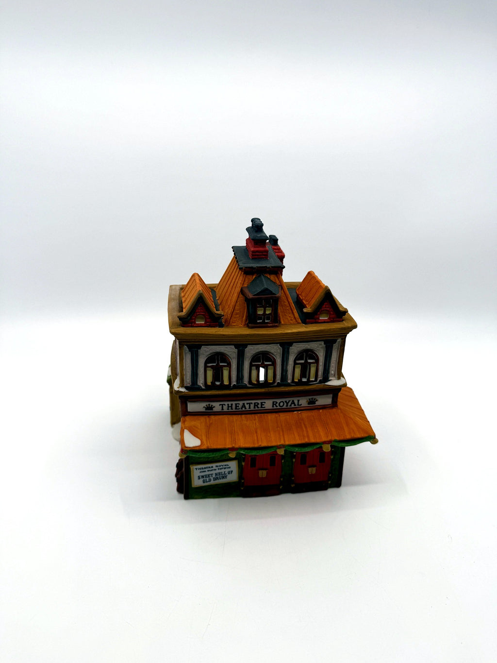 Front view from above showing the mansard roof, dormers and twin brick chimneys