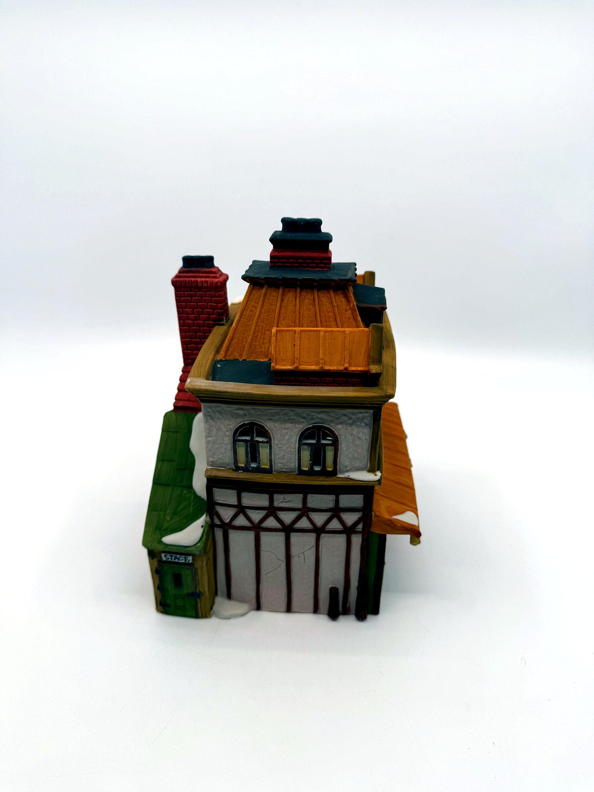 Side view with the green stage door and timbered back wall
