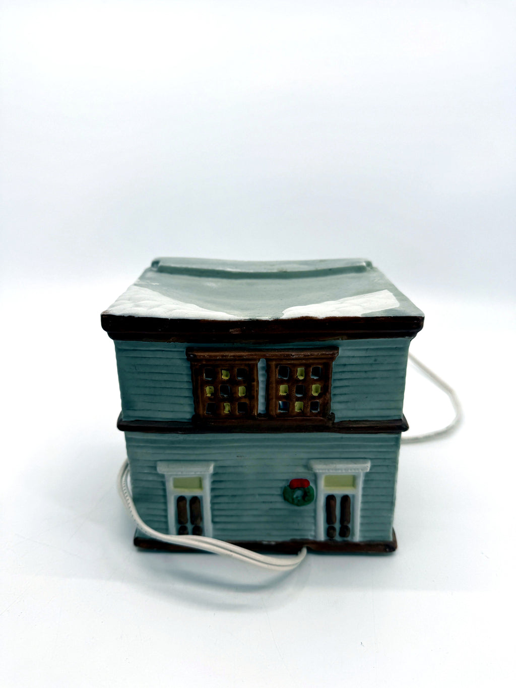 Ceramic Christmas village Toy and Doll shop, back view with two doors and a wreath
