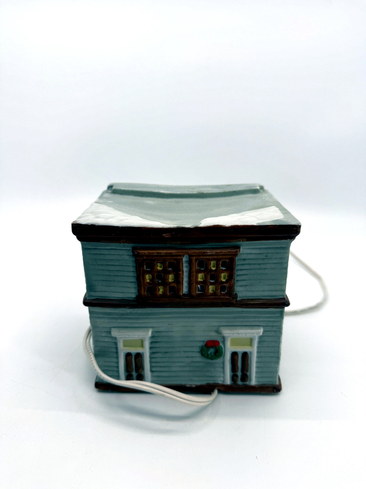 Ceramic Christmas village Toy and Doll shop, back view with two doors and a wreath