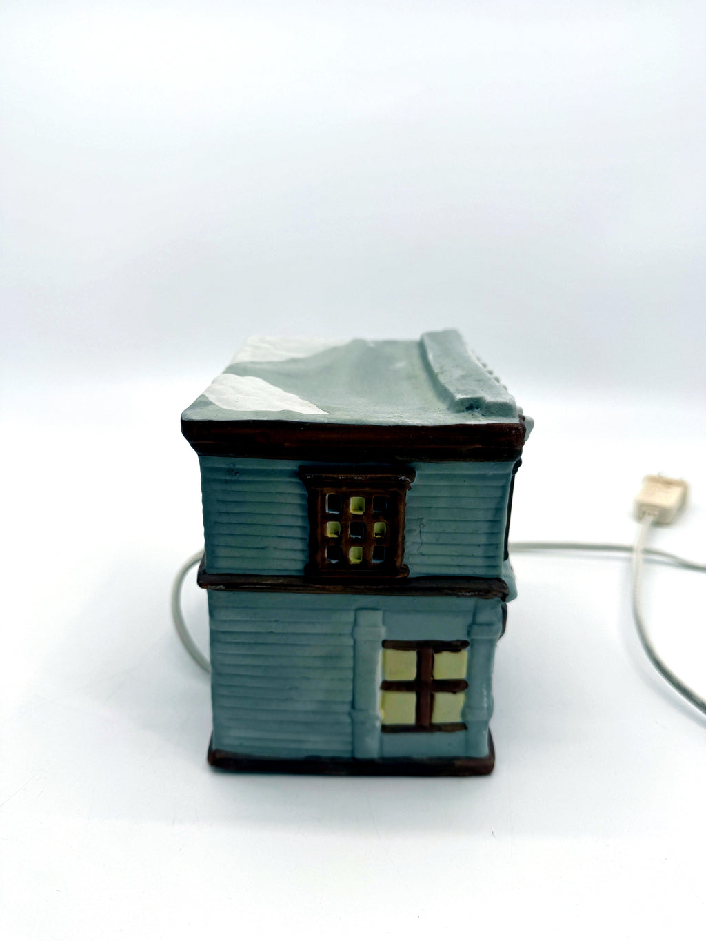 Ceramic Christmas village Toy and Doll shop, left side view with cord and plug