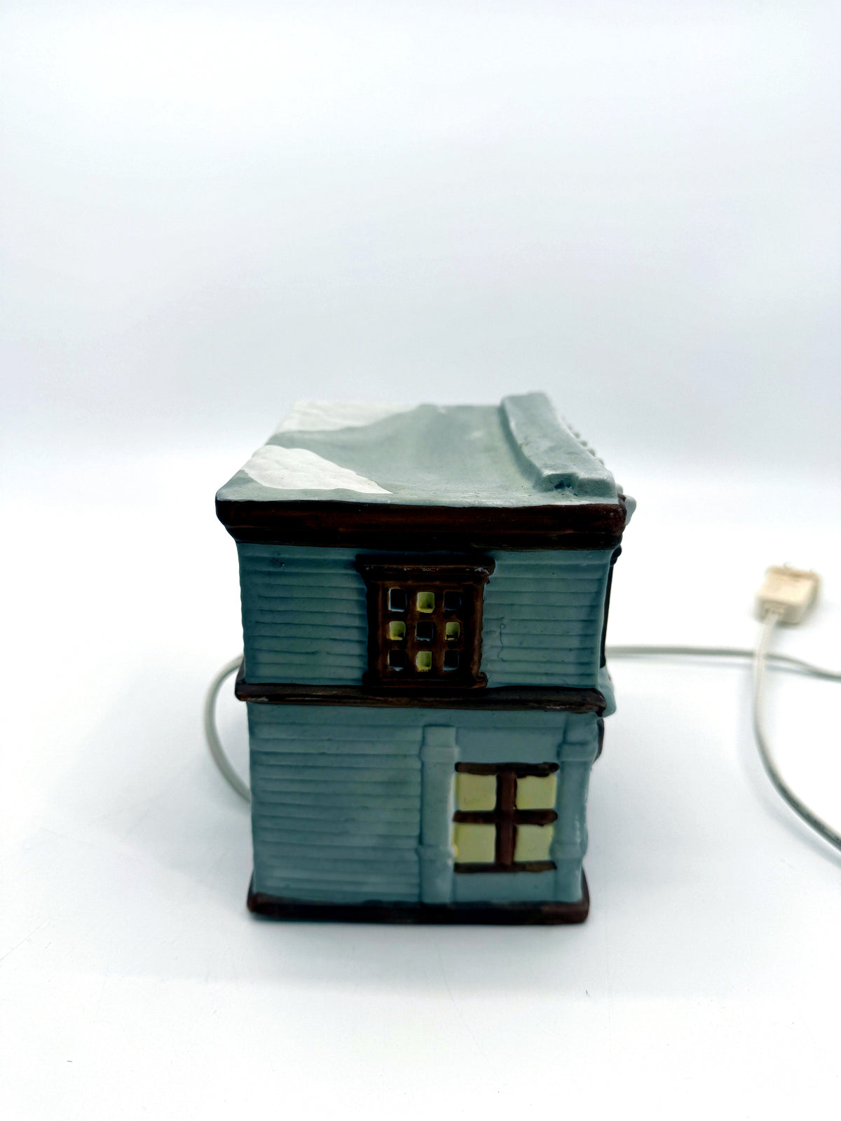 Ceramic Christmas village Toy and Doll shop, left side view with cord and plug