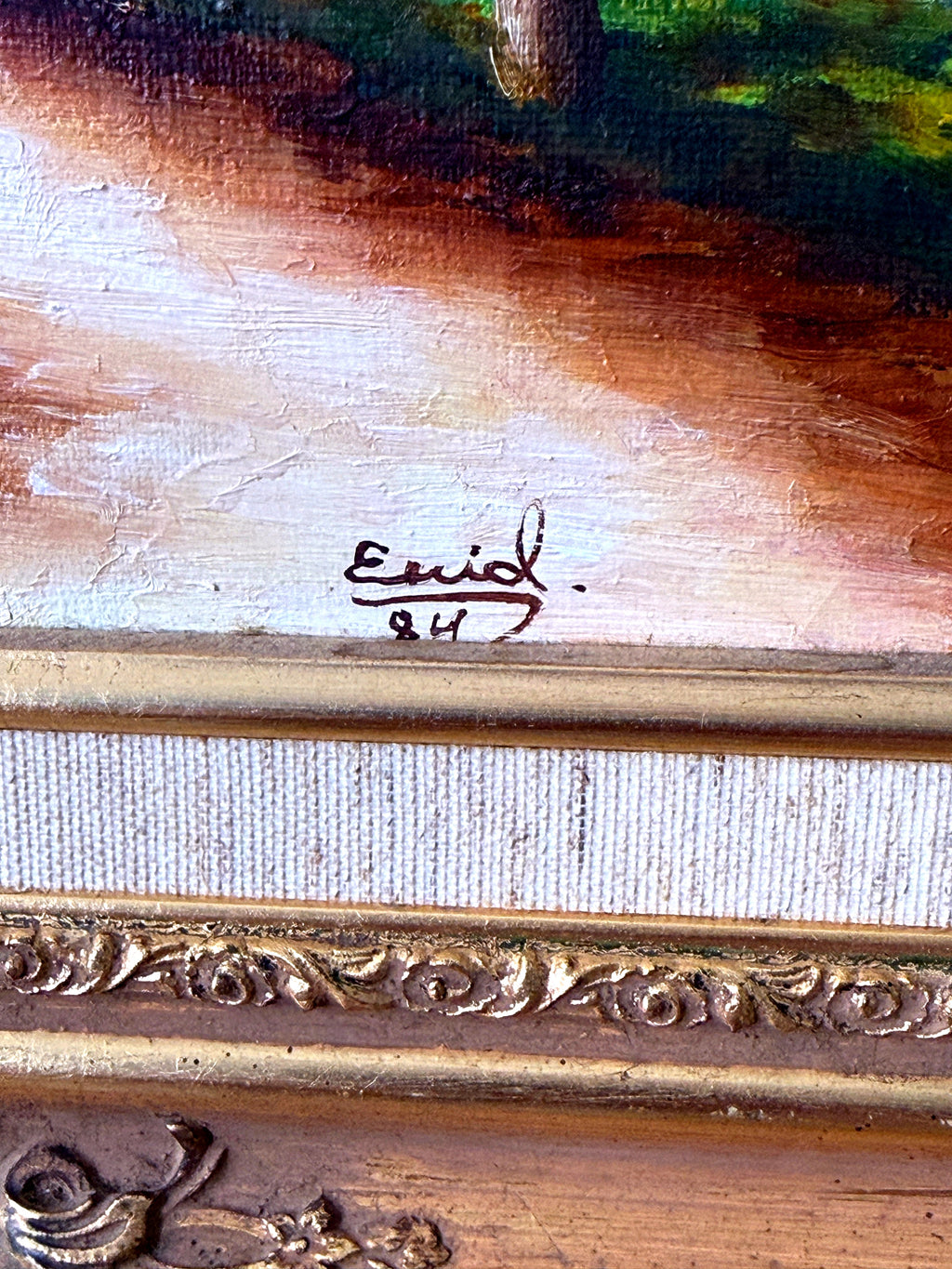 1984 signed oil on canvas tropical cottage landscape, framed — close-up of the signature — 'Enid', dated 84