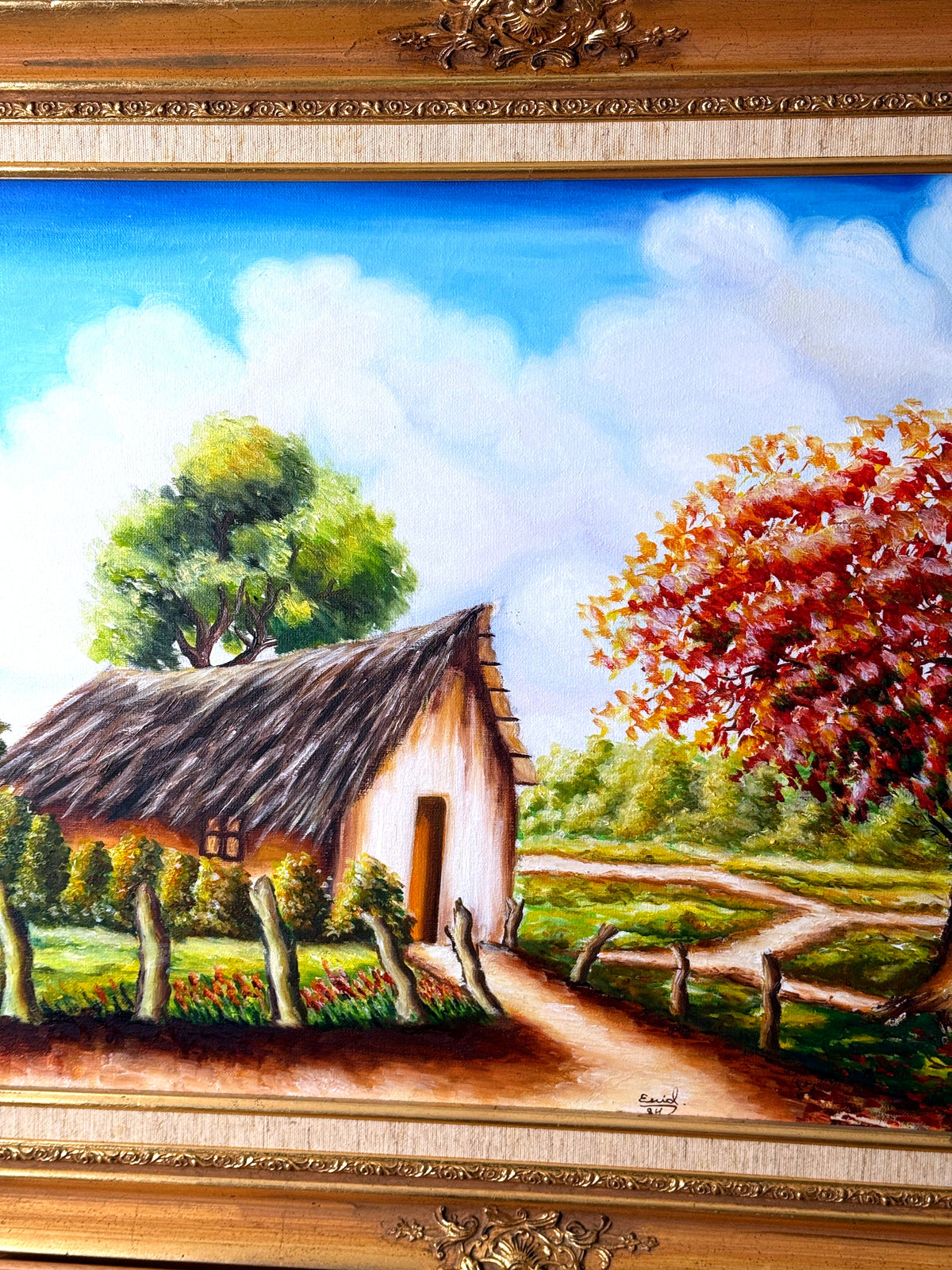 1984 signed oil on canvas tropical cottage landscape, framed — close-up of the right side — thatched cottage and red flowering tree