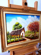 1984 signed oil on canvas tropical cottage landscape, framed — front view from a left angle