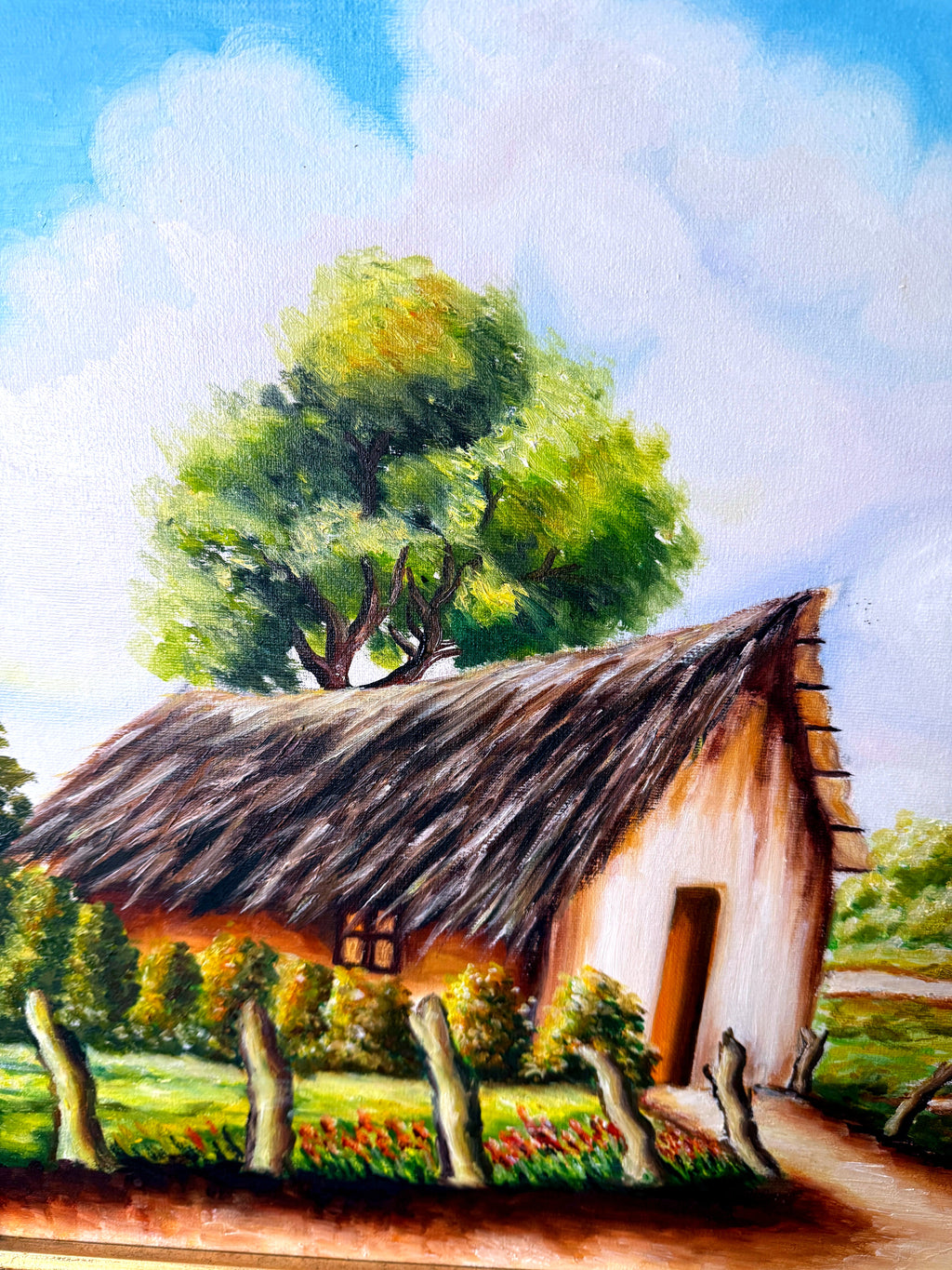 1984 signed oil on canvas tropical cottage landscape, framed — close-up of the thatched cottage