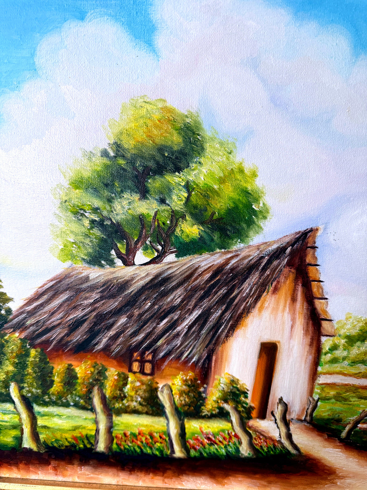 1984 signed oil on canvas tropical cottage landscape, framed — close-up of the thatched cottage