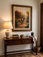Styled lifestyle photo — the framed Tuscan garden print (25 × 32 in) above an entryway console table (display inspiration)