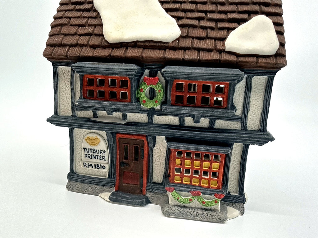 Department 56 Tutbury Printer, Dickens' Village, 1990 – front view: Tudor half-timbering, red windows, wreath, Tutbury Printer RM 1810 sign
