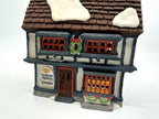 Department 56 Tutbury Printer, Dickens' Village, 1990 – front view: Tudor half-timbering, red windows, wreath, Tutbury Printer RM 1810 sign