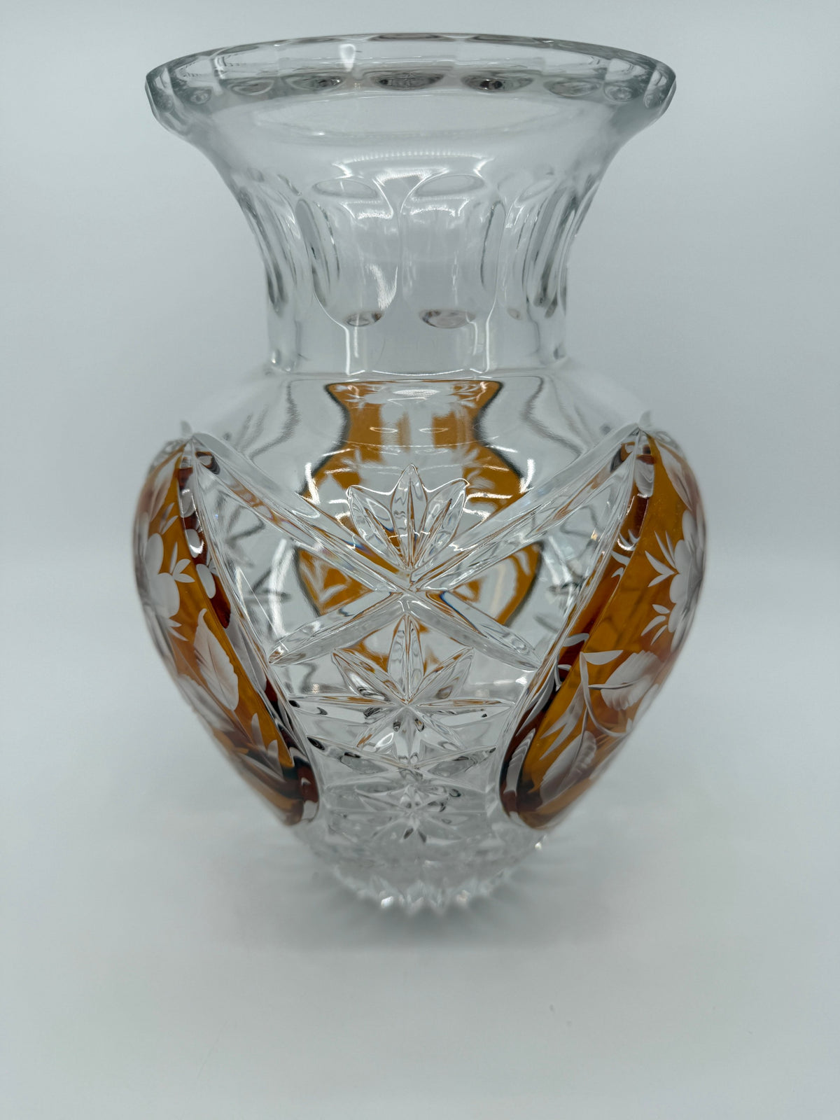 Amber crystal vase, three-quarter close view showing starburst cutting (original color)