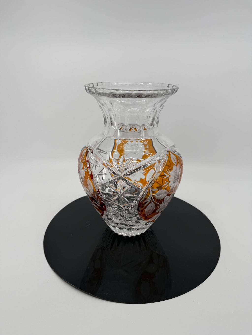 Amber crystal vase on display stand, floral panel front (original color)