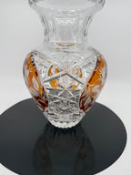 Amber crystal vase, close view on display stand showing floral panel (original color)