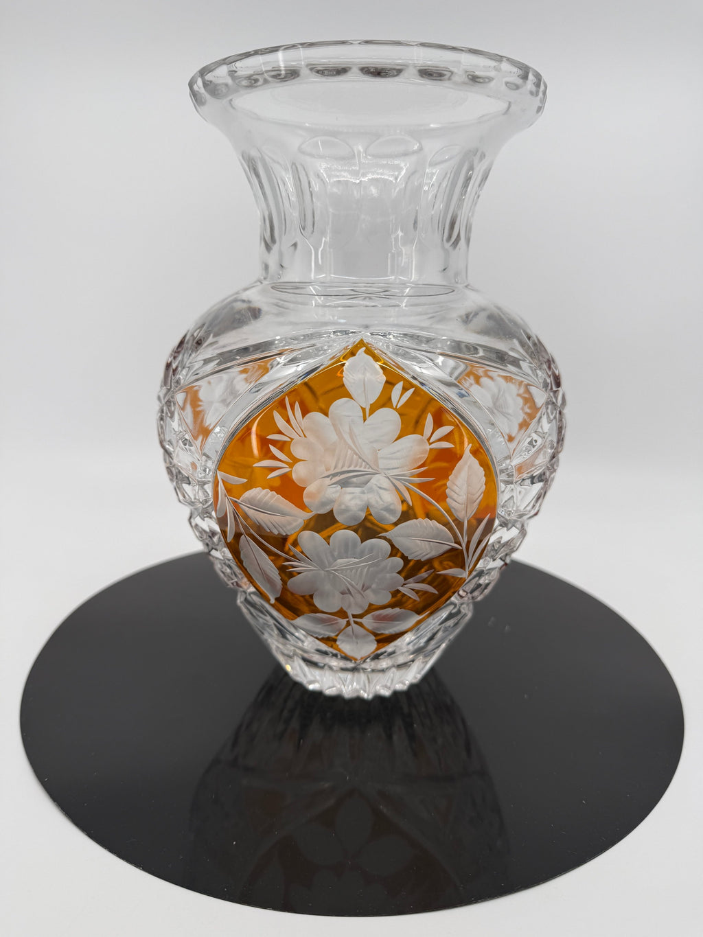 Amber crystal vase on display stand, wide front view (original color)