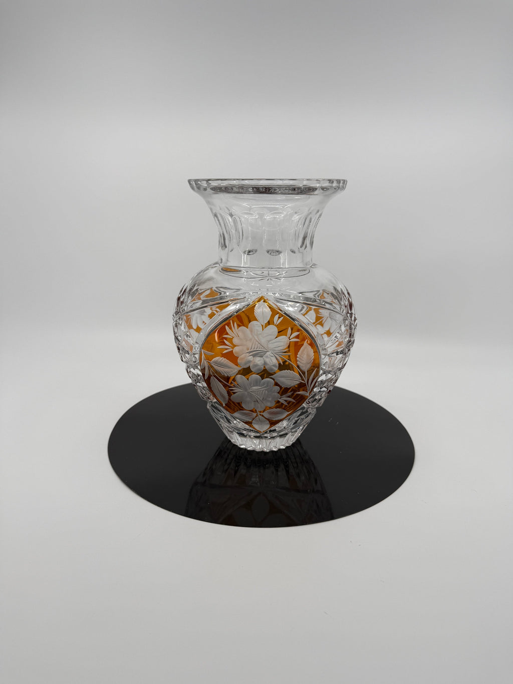 Amber crystal vase, front view on display stand (original color)