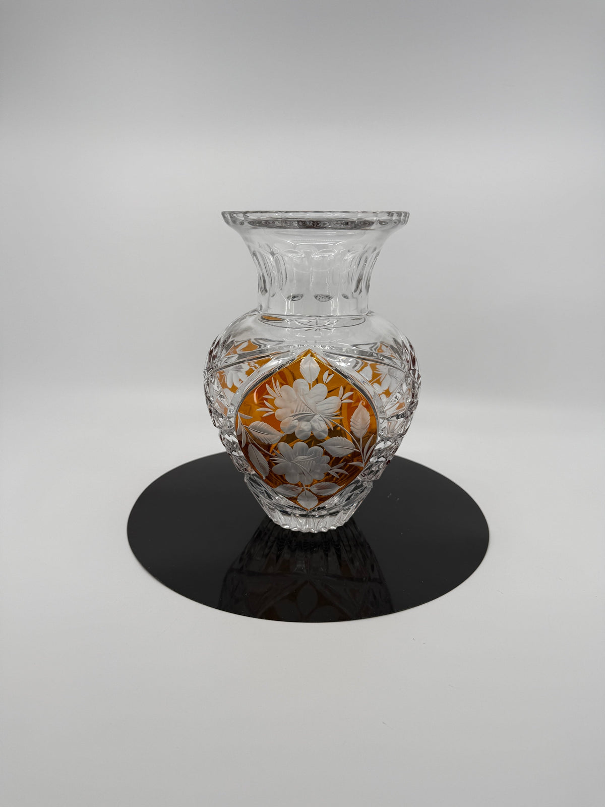 Amber crystal vase, front view on display stand (original color)