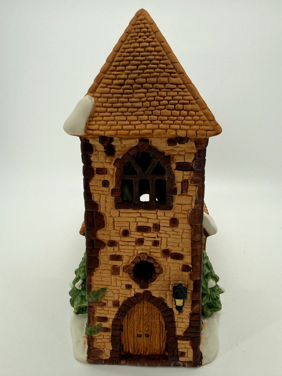 Department 56 Dickens' Village Church 1985 – front view of the stone tower, steep shingled spire and arched wooden door