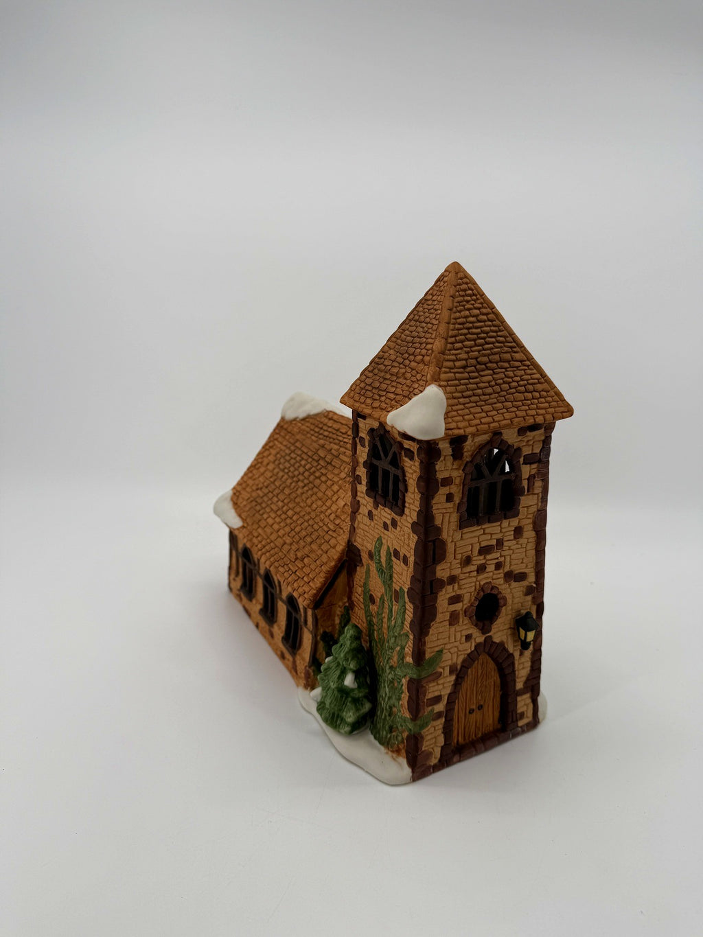 Department 56 Dickens' Village Church – three-quarter view showing the stone tower and nave