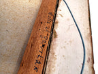 1984 signed oil on canvas Venezuelan street scene, framed — close-up of the handwritten inscription and date on the stretcher bar