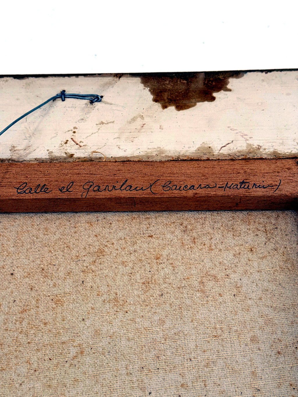 1984 signed oil on canvas Venezuelan street scene, framed — the stretcher bar inscribed with the street's title in Spanish