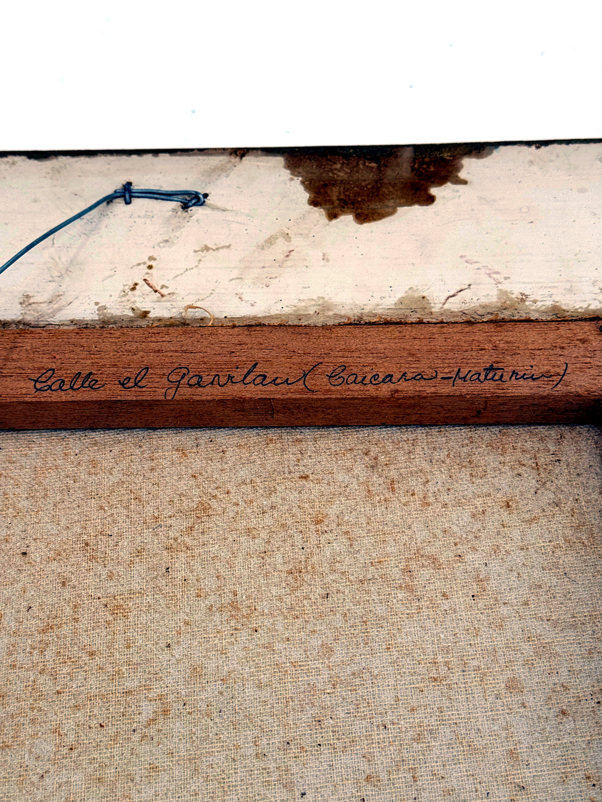 1984 signed oil on canvas Venezuelan street scene, framed — the stretcher bar inscribed with the street's title in Spanish
