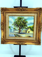 1984 signed oil on canvas Venezuelan street scene, framed — front view on the stand