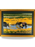 Signed Vietnamese hand-embroidered textile art — water buffalo in rice terraces — the framed embroidery on a display stand, full view