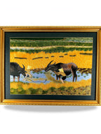 Signed Vietnamese hand-embroidered textile art — water buffalo in rice terraces — the framed embroidery on a display stand, full view
