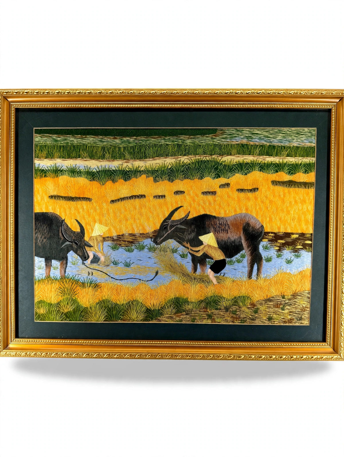Signed Vietnamese hand-embroidered textile art — water buffalo in rice terraces — the framed embroidery on a display stand, full view