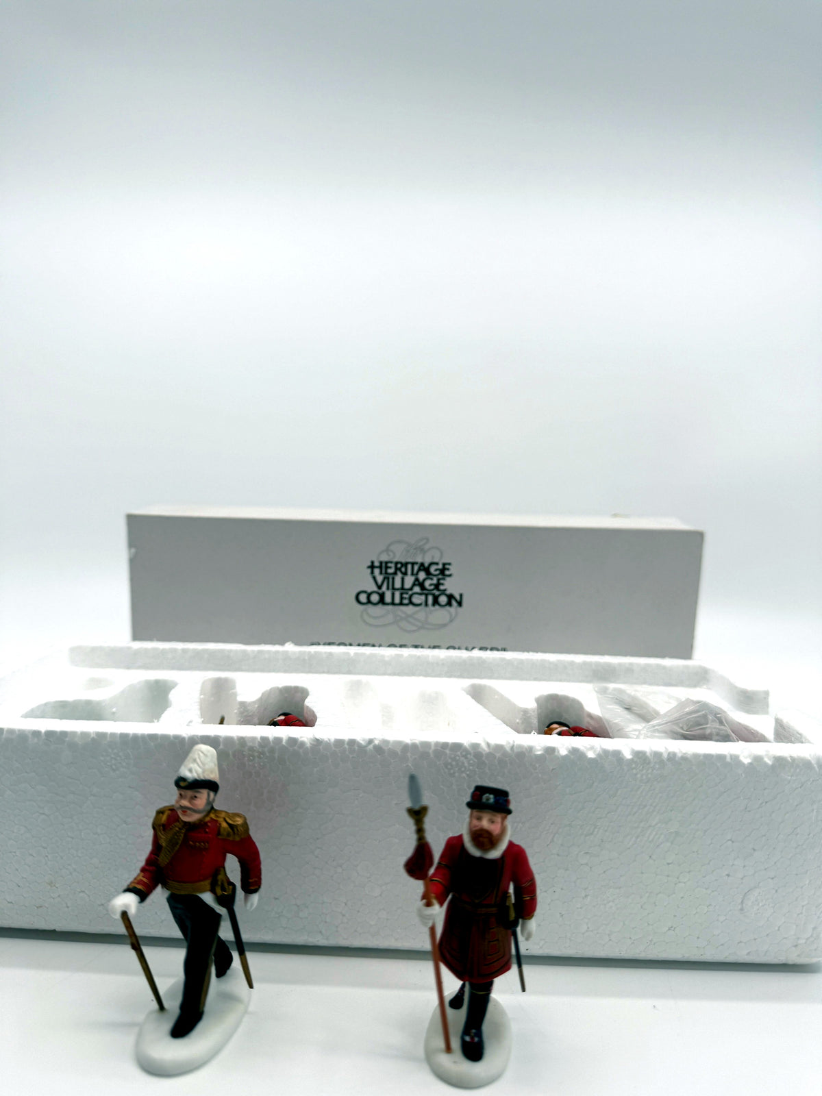 Department 56 Dickens' Village Yeomen of the Guard, set of 5 - the officer and one Beefeater guard standing, wide view with the original box behind